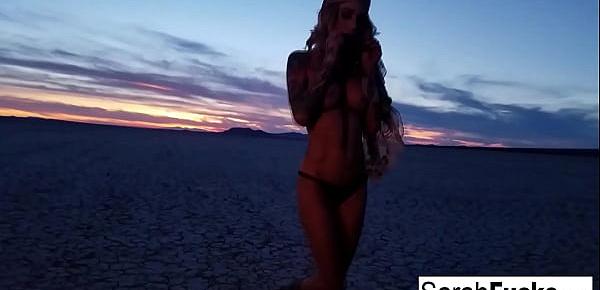  Sexy Tattooed hottie strips on a dry bed lake